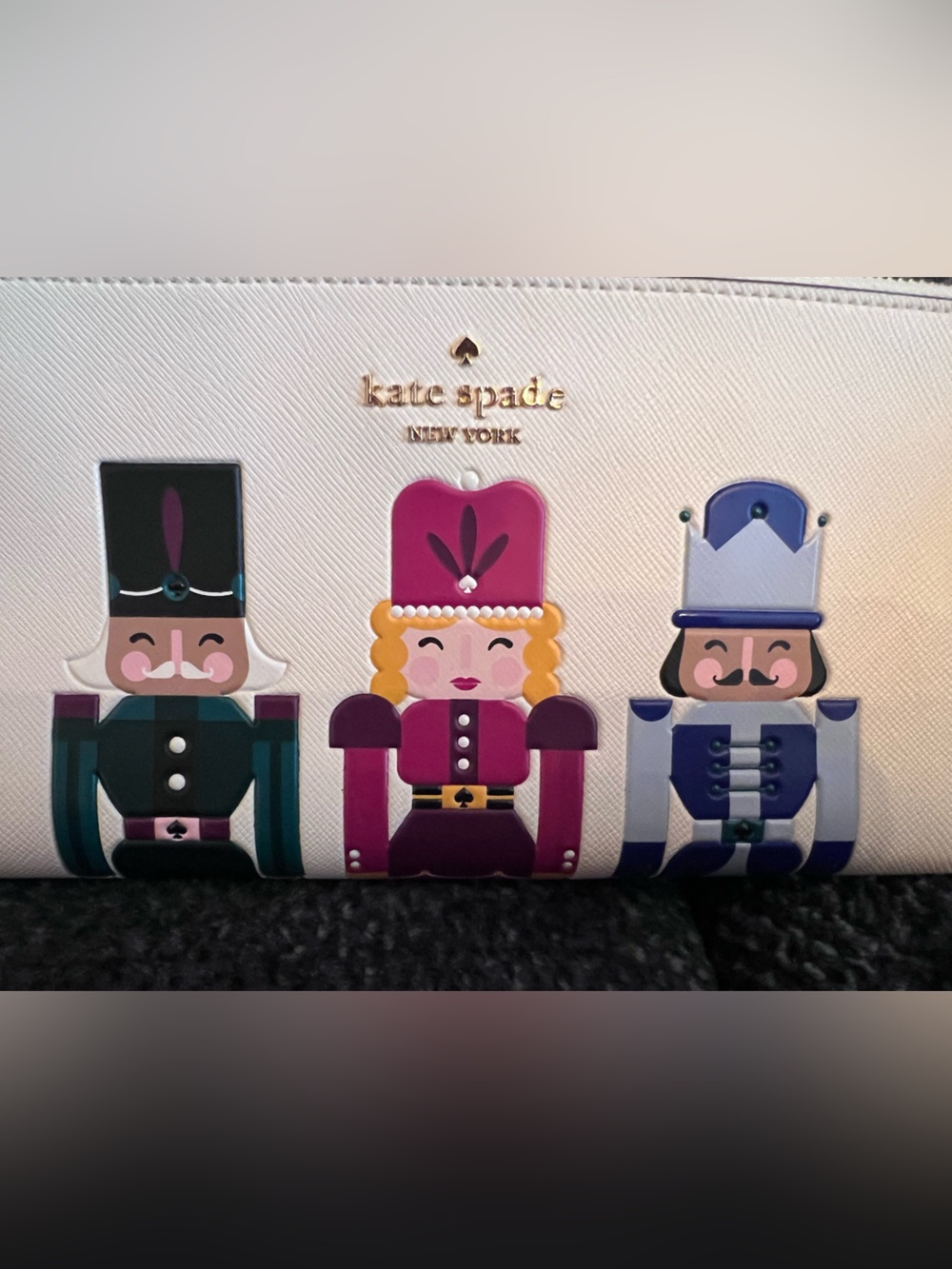 NWOT Kate Spade Cream wristlet with  Nutcracker Appliqués! Never used.